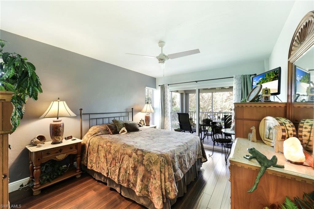 Bedroom featuring ceiling fan, wood finished floors, and access to exterior