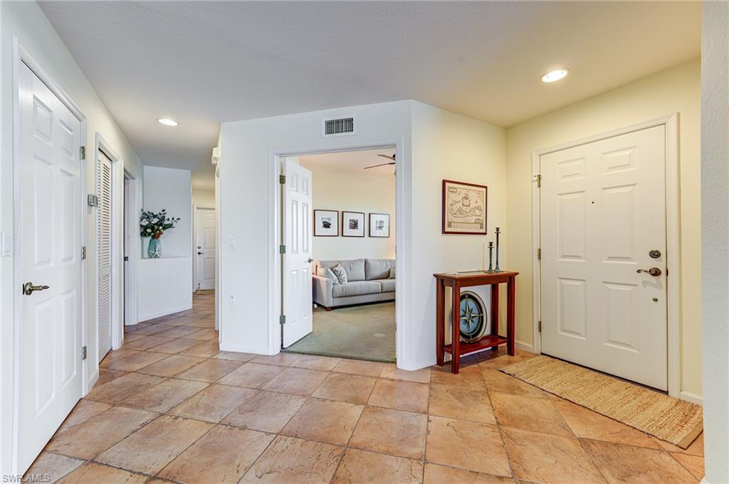 Entry vestibule, with den.  Guest room, bath, laundry and garage down this hallway
