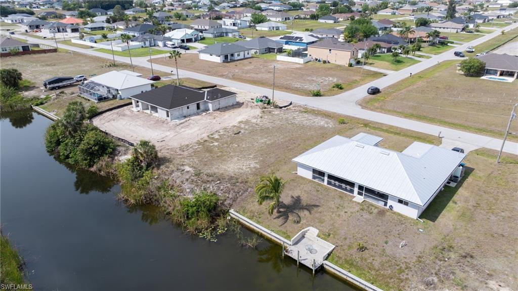 Aerial view with a residential view and a water view