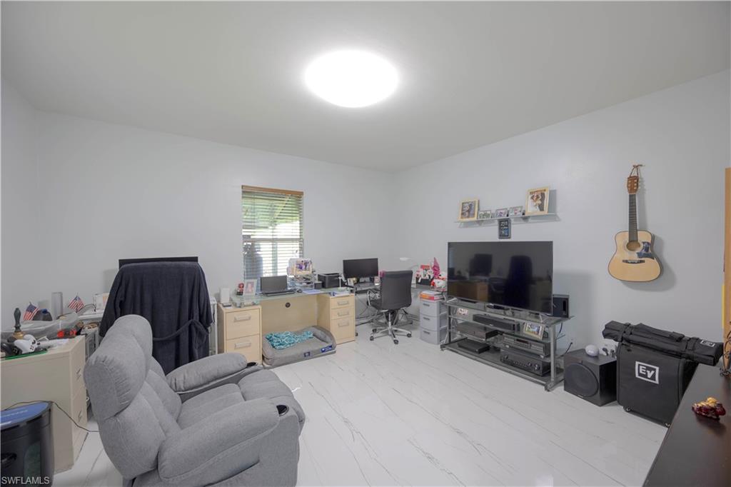 Home office with marble finish floor