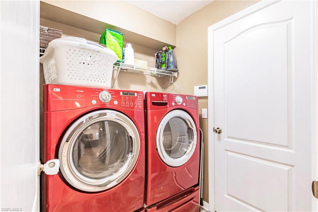 Laundry area featuring washing machine and clothes dryer