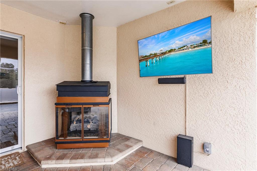 Details with stucco siding and a wood stove