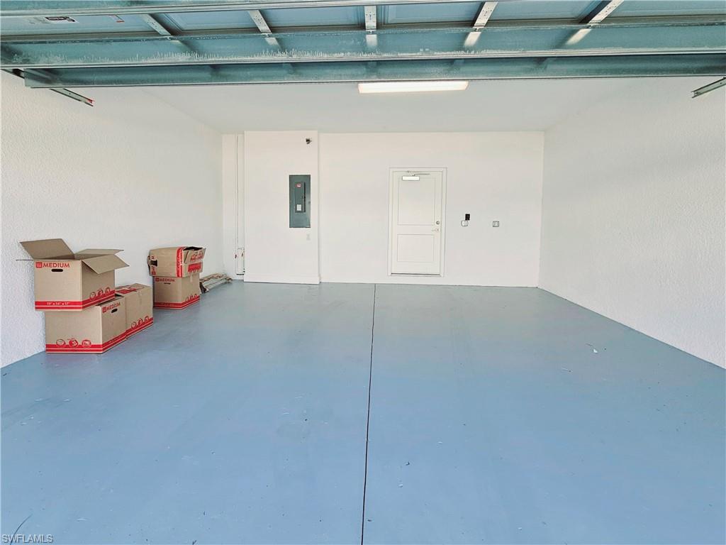 Garage featuring electric panel