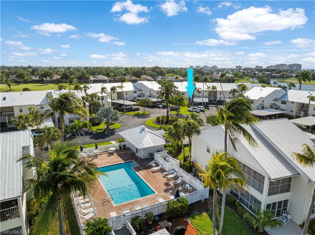The community pool is steps away from this condo.