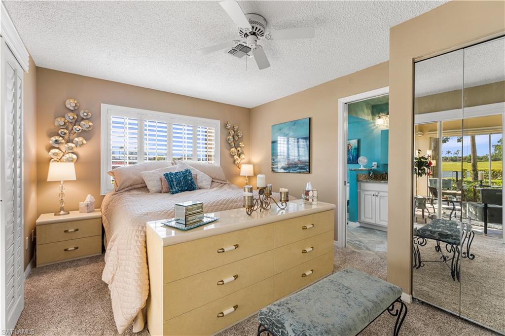 Your master suite has a extra mirrored closet on the right. Plantation shutters.