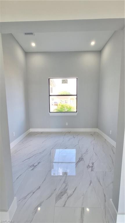 Hallway with light marble finish flooring