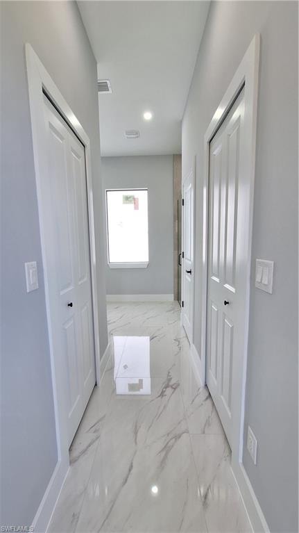 Spare room with baseboards and marble finish floors