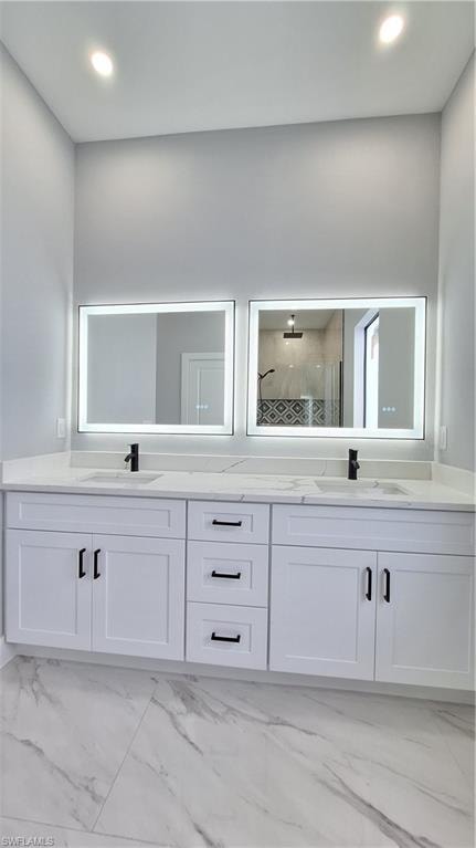 Spare room with light marble finish flooring and a ceiling fan