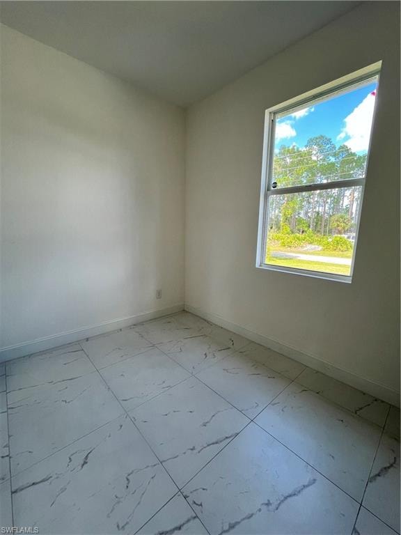 Empty room with light marble finish floors