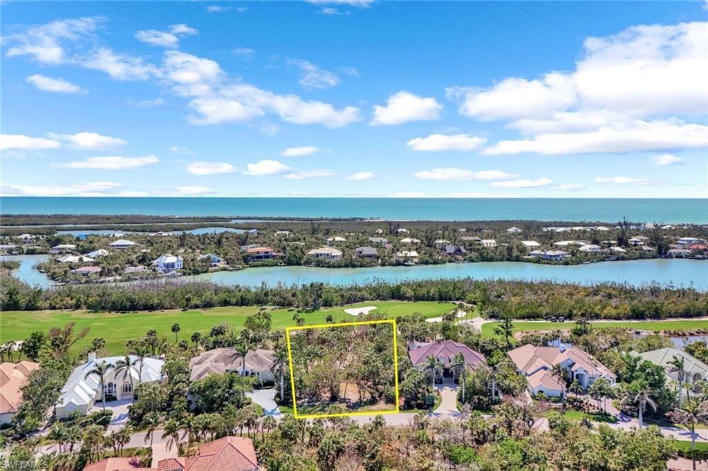 Bird's eye view featuring golf course view and a water view
