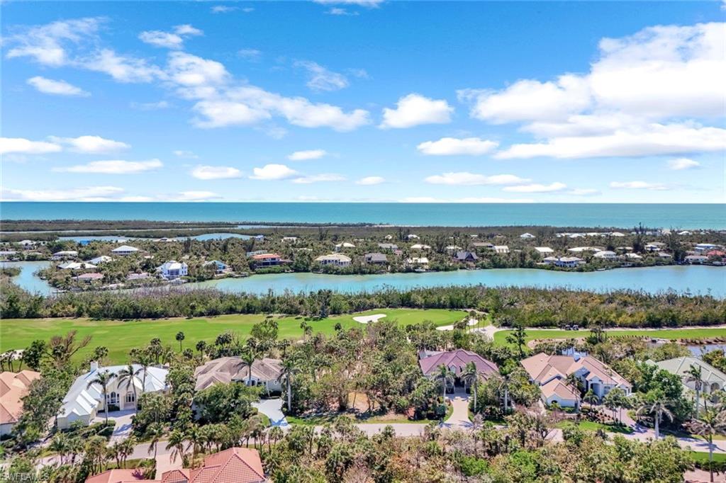 Bird's eye view featuring view of golf course and a water view