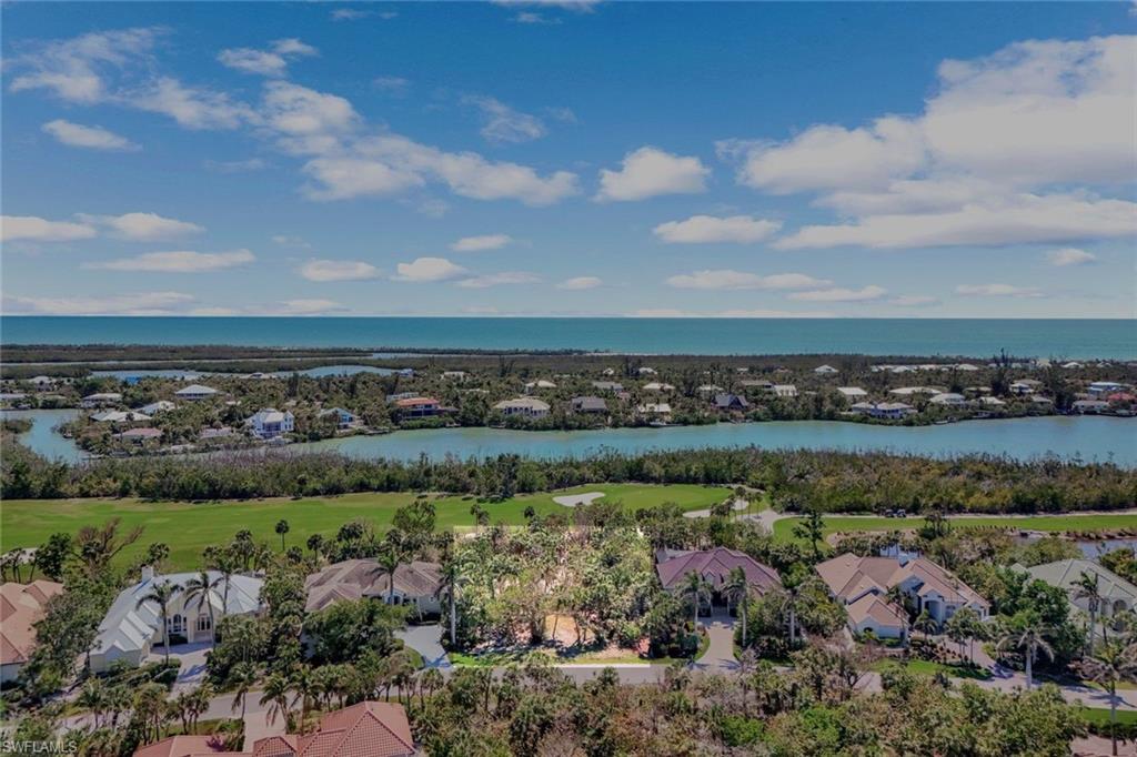 Drone / aerial view featuring view of golf course and a water view