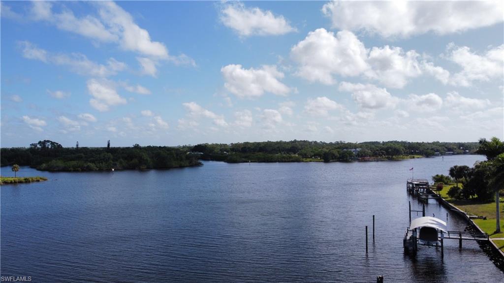 Dock area featuring a water view