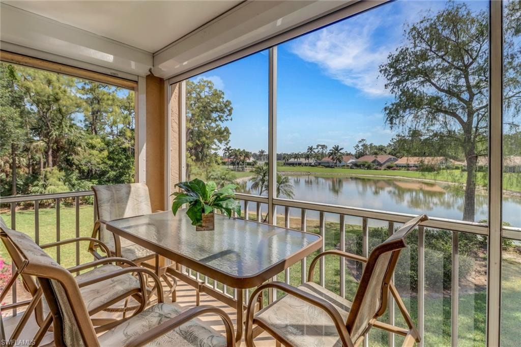 Sunroom with a water view