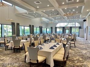 Dining room featuring a high ceiling, coffered ceiling, and beamed ceiling
