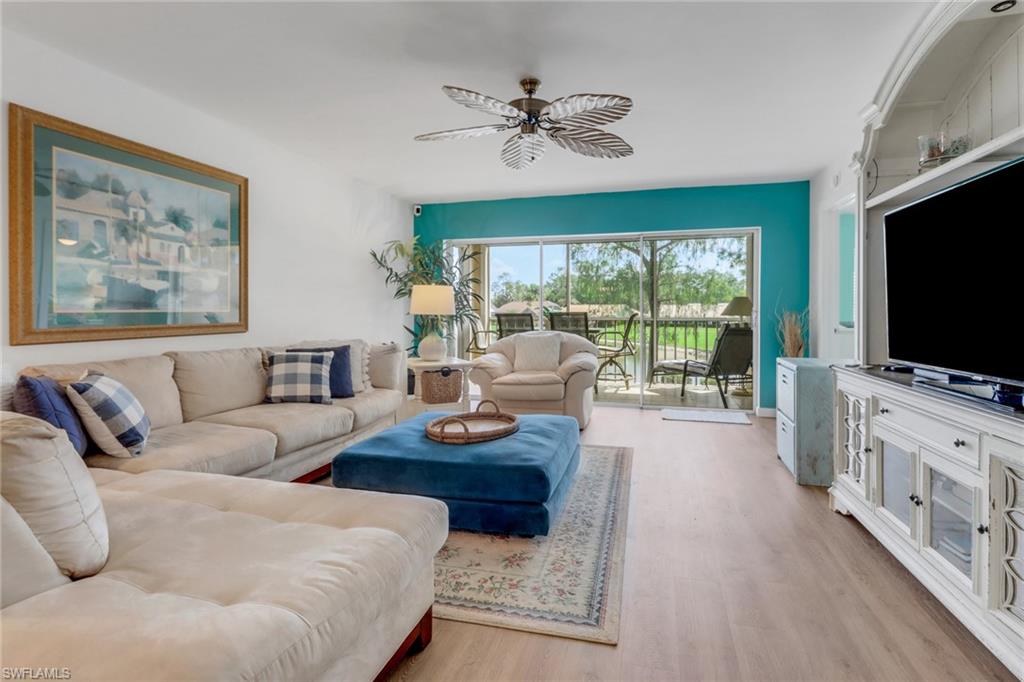 Living area featuring ceiling fan and light wood-style flooring