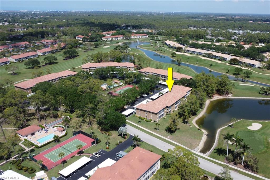Bird's eye view featuring a water view and view of golf course