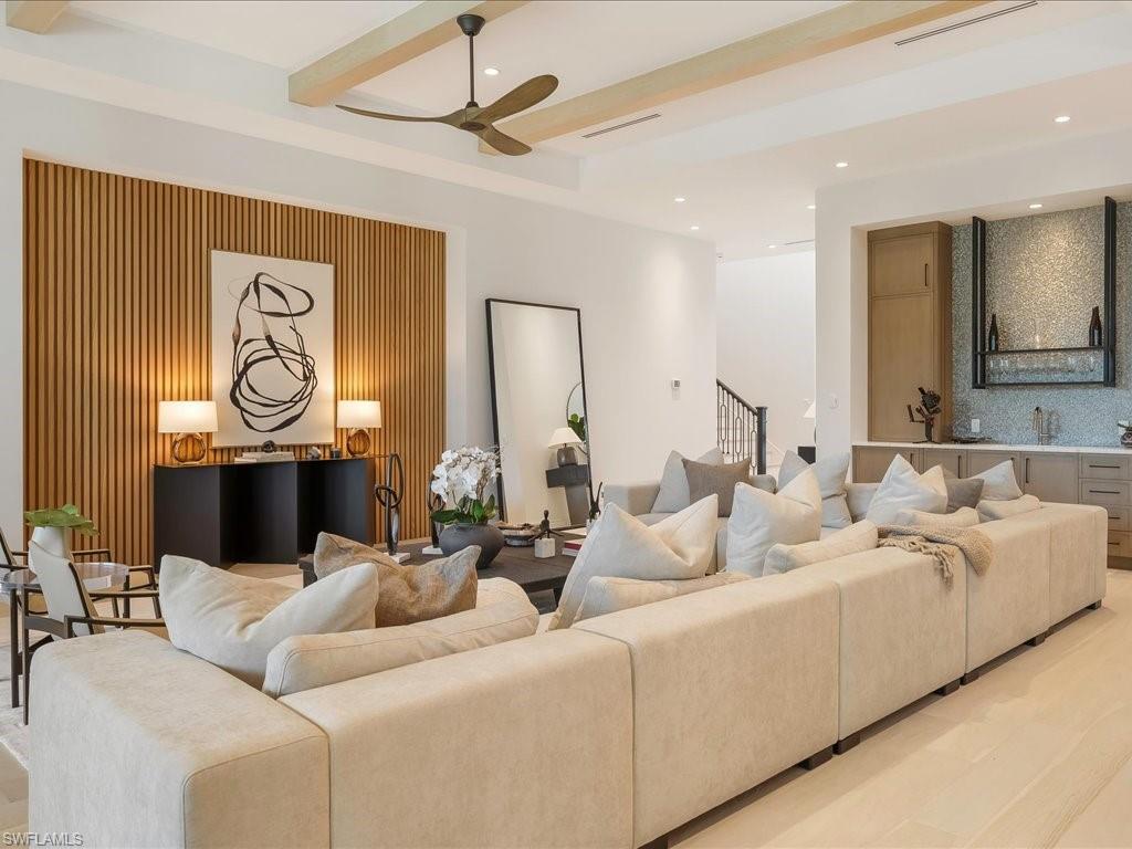 Living room with recessed lighting, beam ceiling, visible vents, and ceiling fan