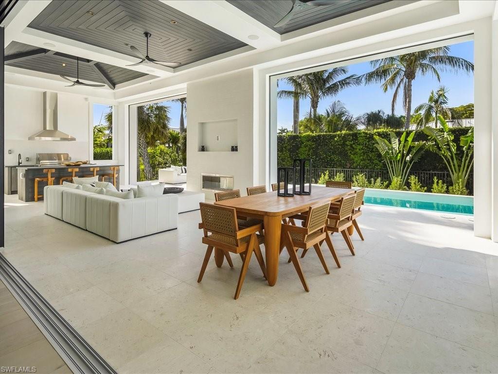 Dining room with coffered ceiling and a ceiling fan