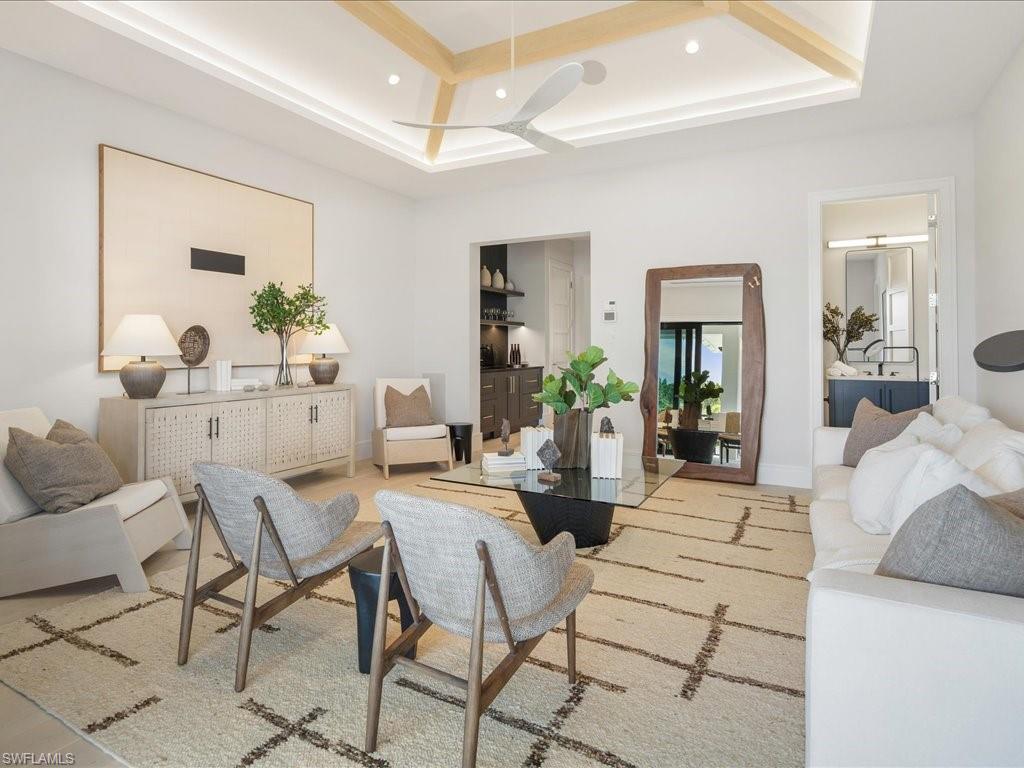 Living room with recessed lighting and a ceiling fan