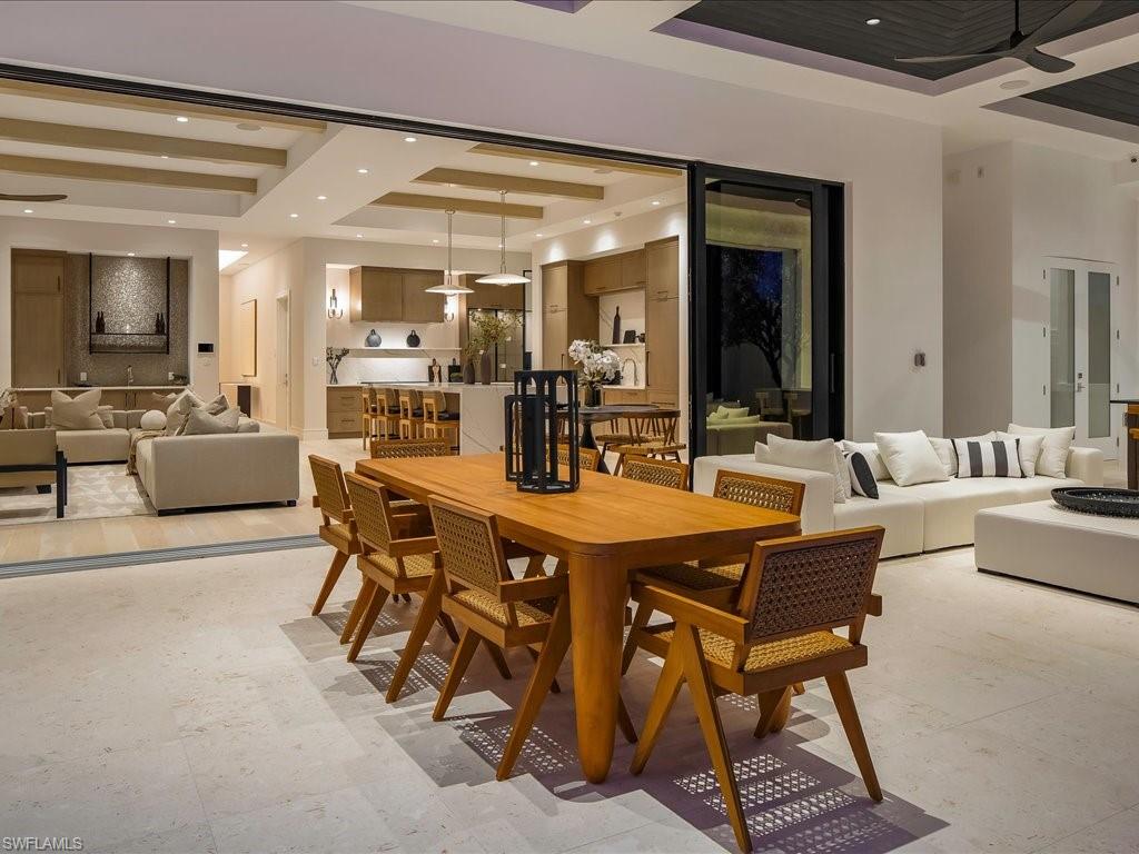 Dining space featuring a tray ceiling and recessed lighting