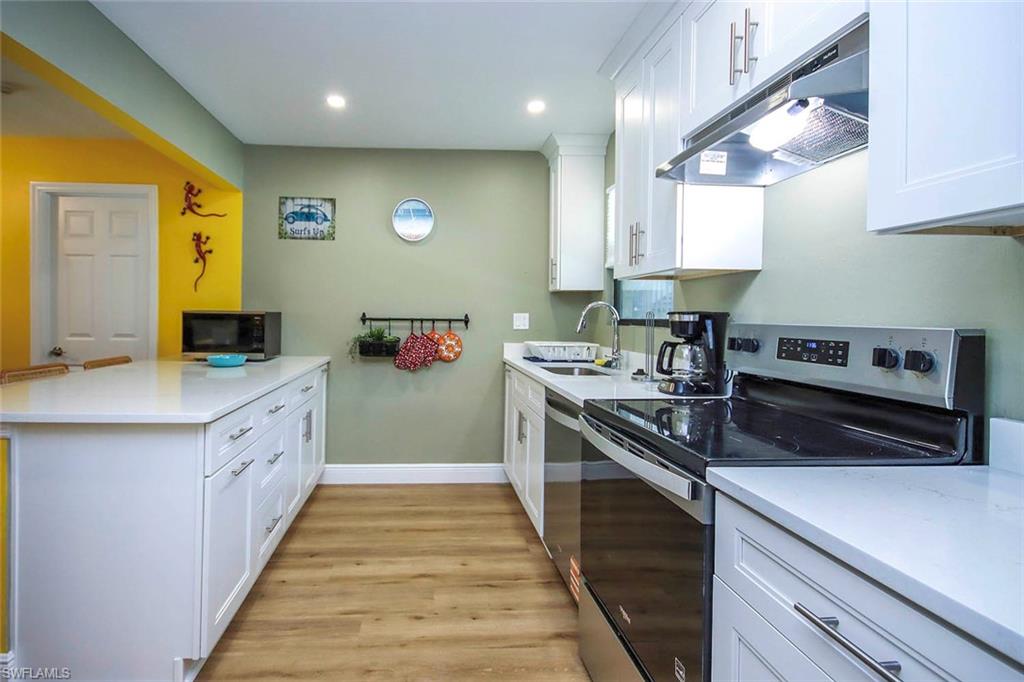 Kitchen with light quartz countertops