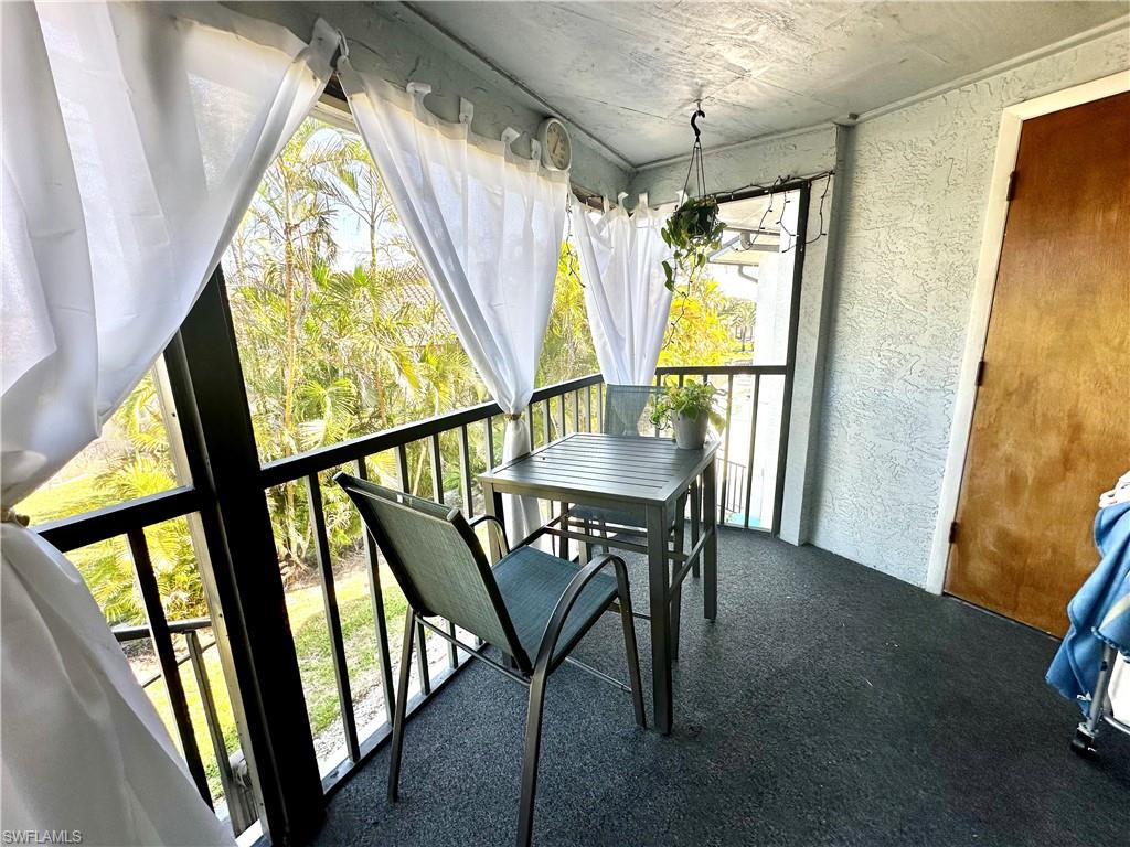 Screen Lanai off Living Room (Wooden Door is laundry)