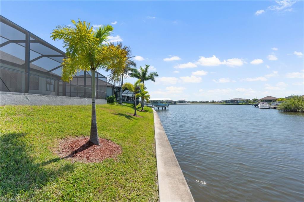 View of water feature with a boat dock