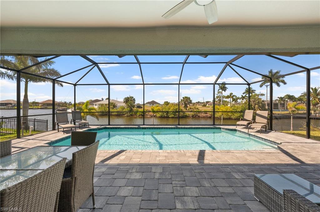 Pool with a lanai and a patio
