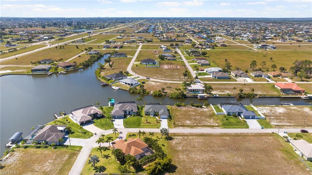 Drone / aerial view featuring a residential view and a water view