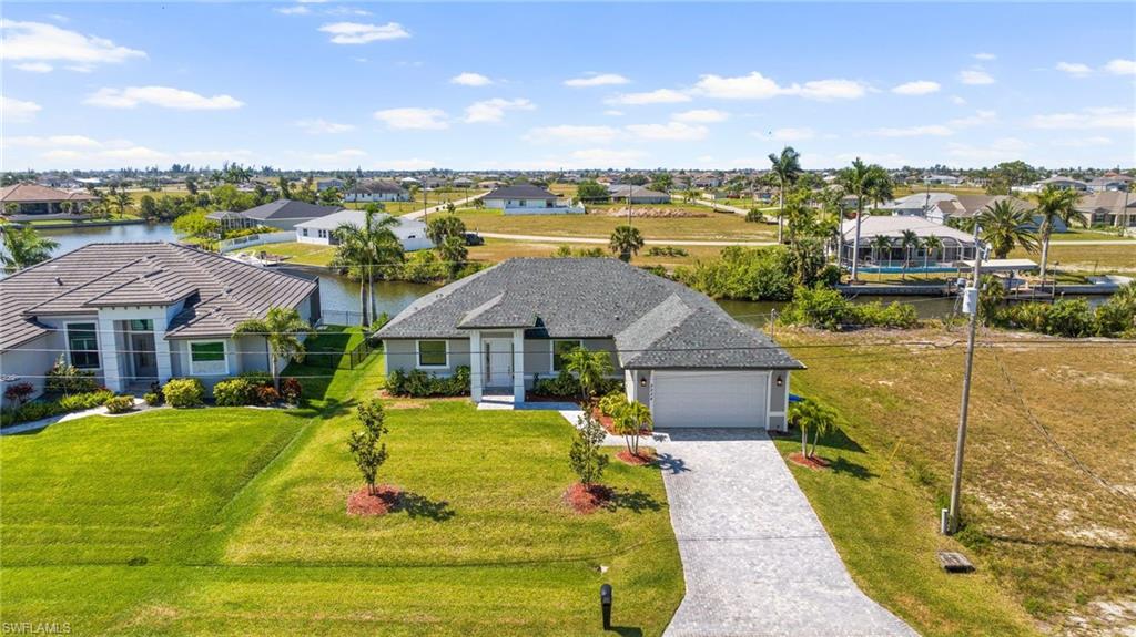 Birds eye view of property featuring a residential view and a water view