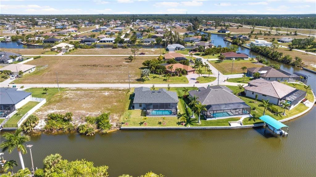 Bird's eye view with a water view and a residential view