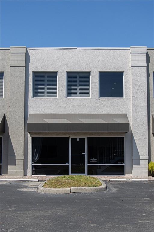 View of front facade featuring stucco siding