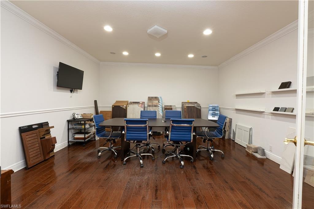 Office area featuring wood-type flooring, ornamental molding, and recessed lighting