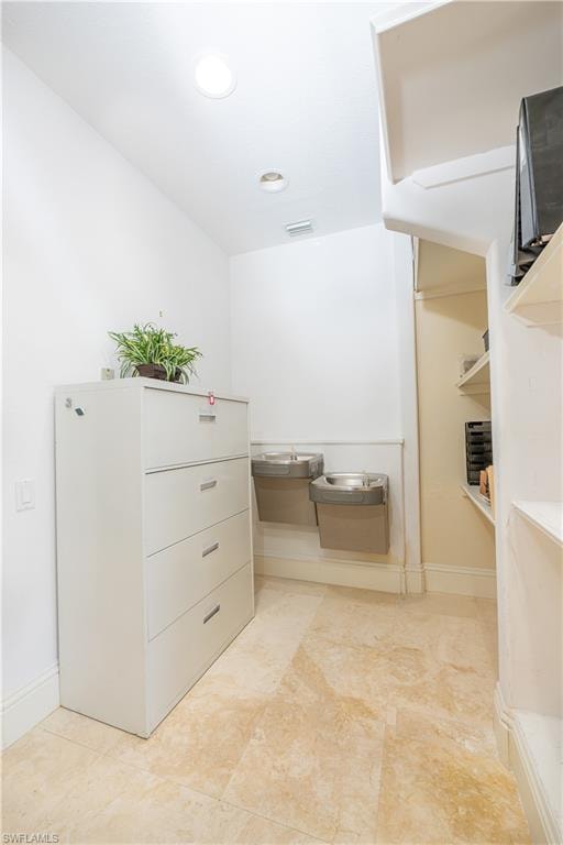 Walk in closet with visible vents