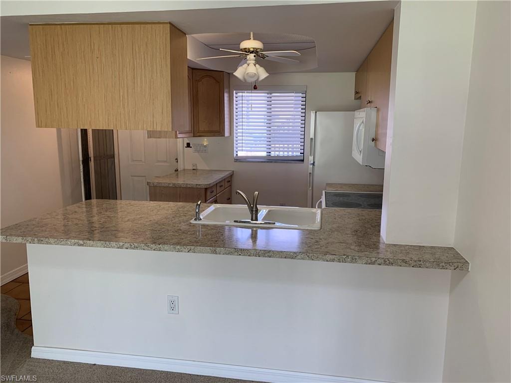 Kitchen with breakfast counter.