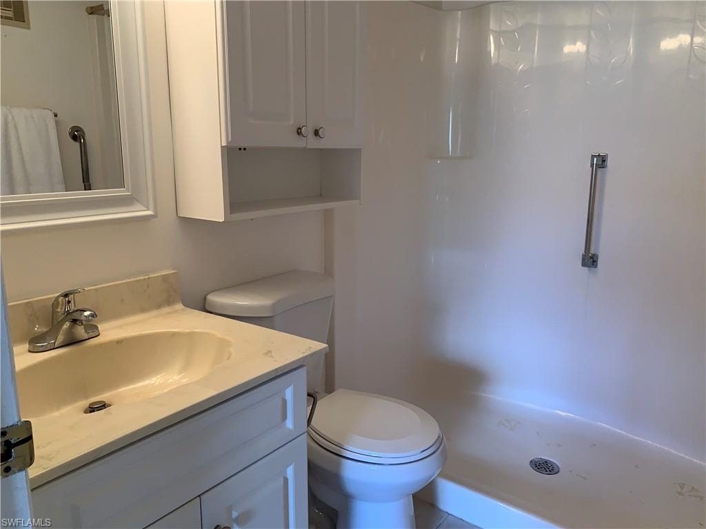 Master Bathroom with vanity and step in shower.