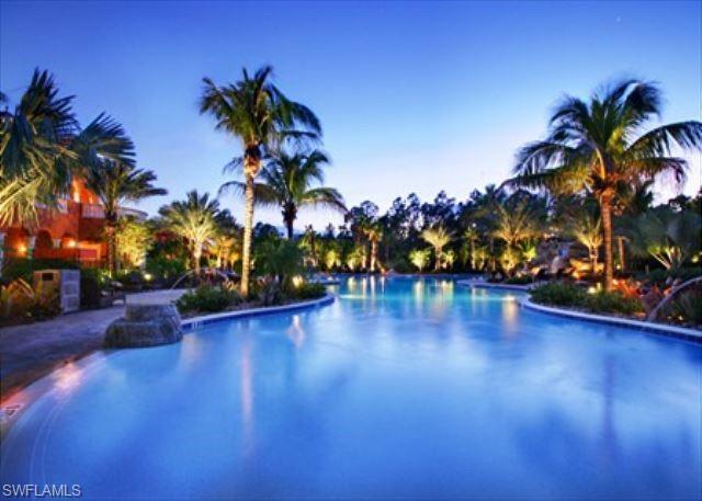 View of community zero entry pool at dusk