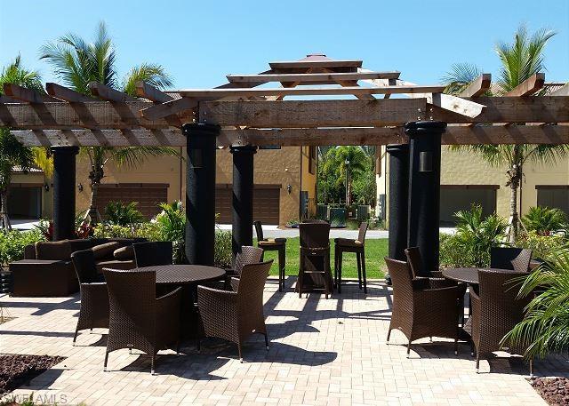 View of patio featuring outdoor dining space and a pergola