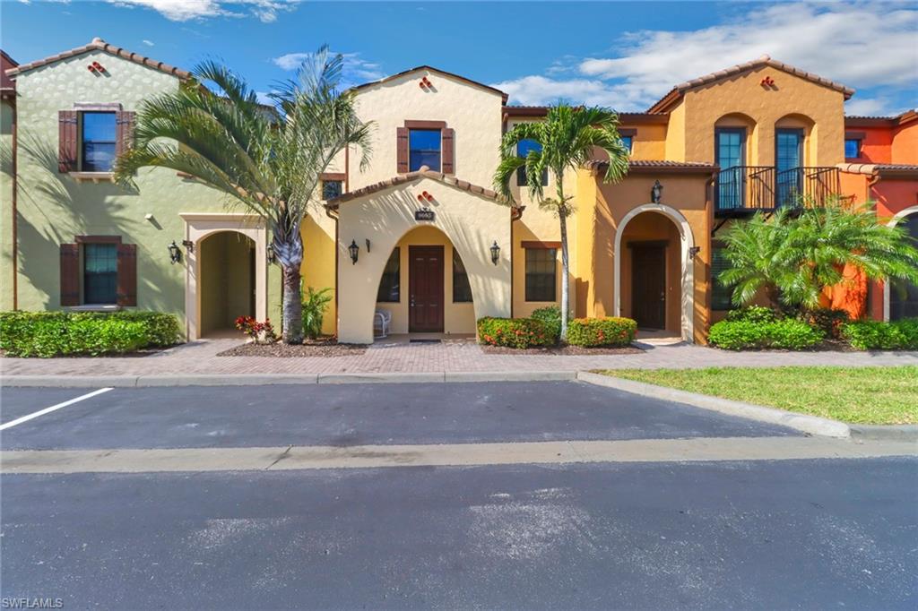 Mediterranean / spanish-style house with a tiled roof, stucco siding, and a balcony