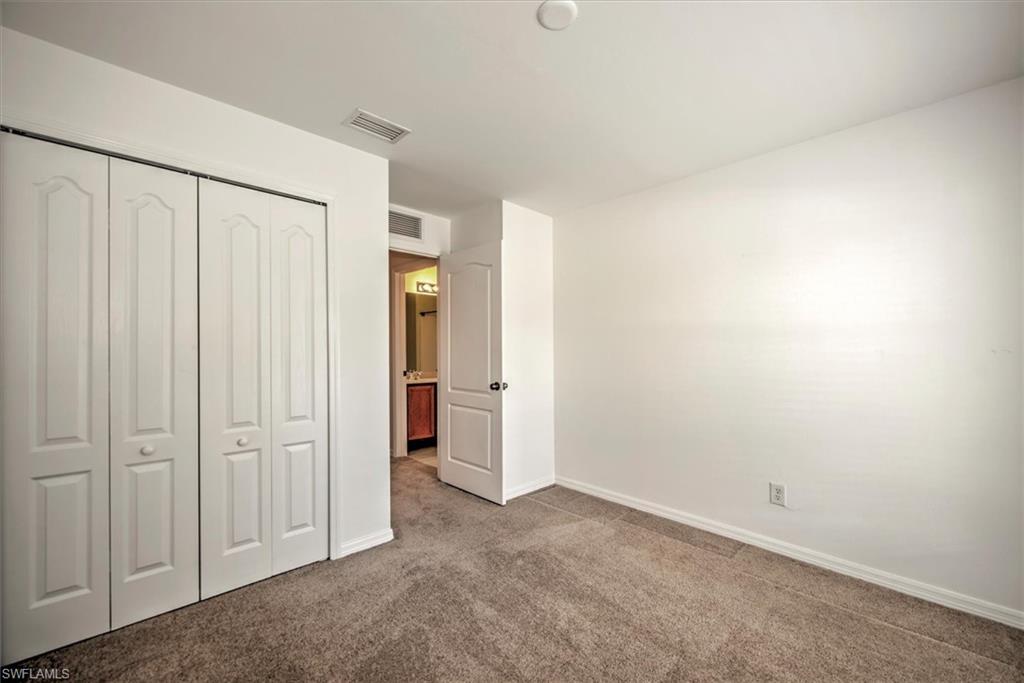bedroom with carpet flooring and a closet