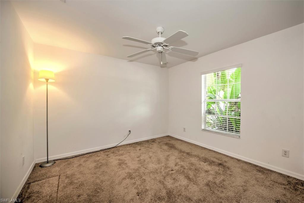 Carpeted 3rd bedroom featuring ceiling fan