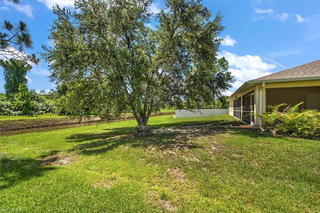 View of yard featuring a sunroom