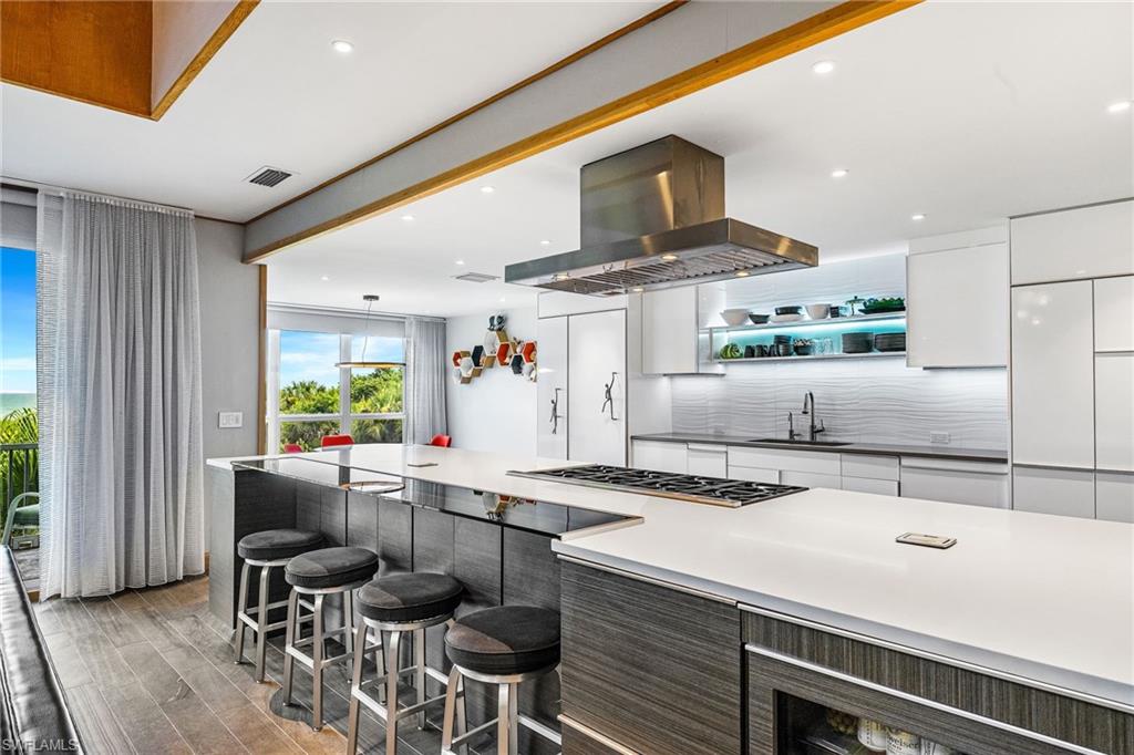 Kitchen with cooking center and breakfast bar
