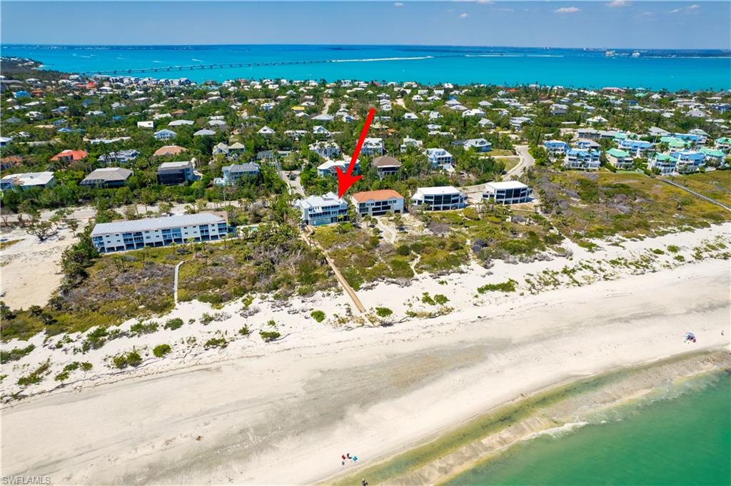 Bird's eye view with a view of the beach from rear of property
