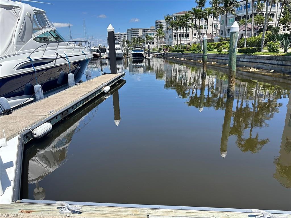 Dock area featuring a water view