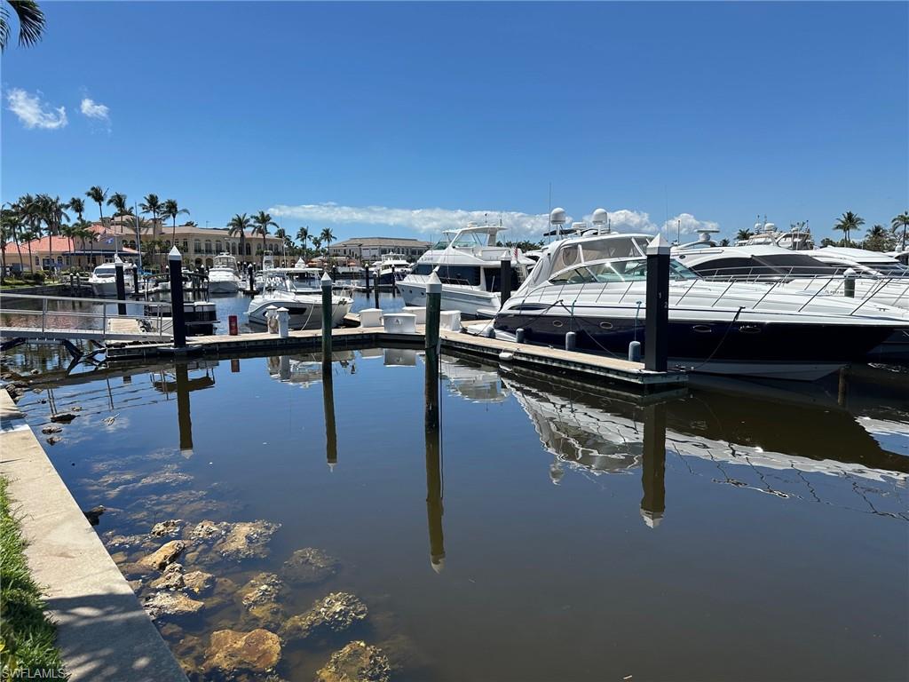 Dock area featuring a water view