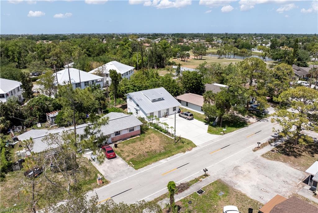 Drone / aerial view featuring a residential view and a water view