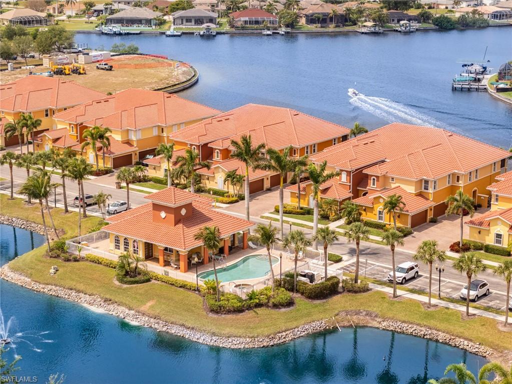 Drone / aerial view featuring a water view and a residential view