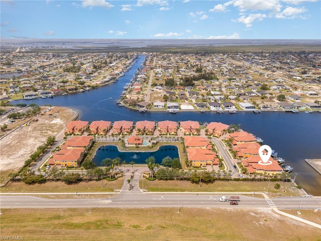 Drone / aerial view featuring a water view and a residential view
